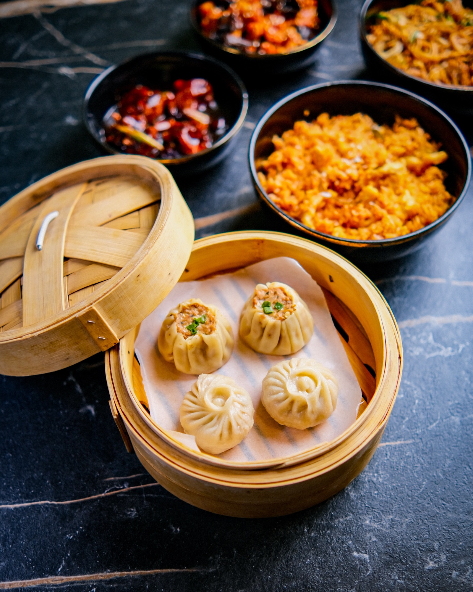Bamboo steamer basket of dumplings shot overhead