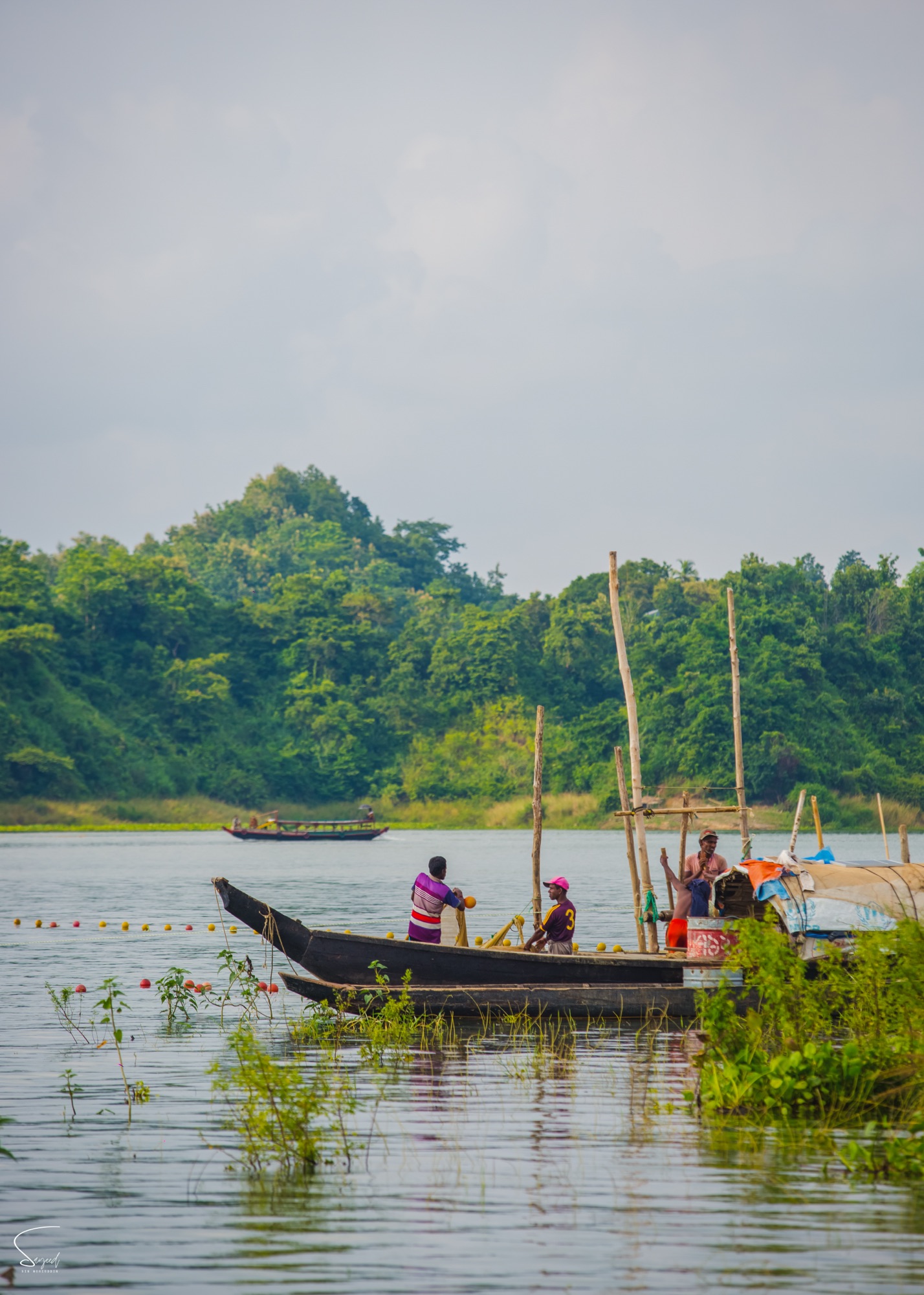 A portrait of fishermen at work, Rangamati