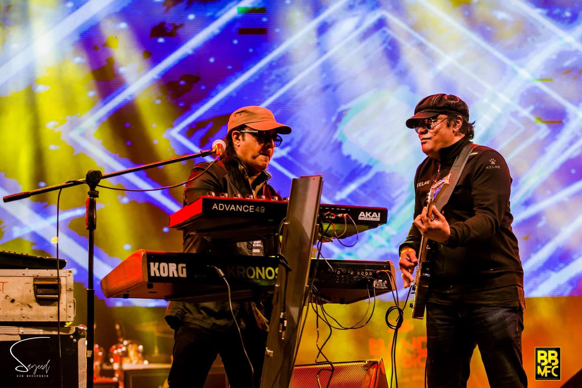 Two musicians sharing a moment on stage at a Shironamhin concert in Dhaka — Sayeed BM