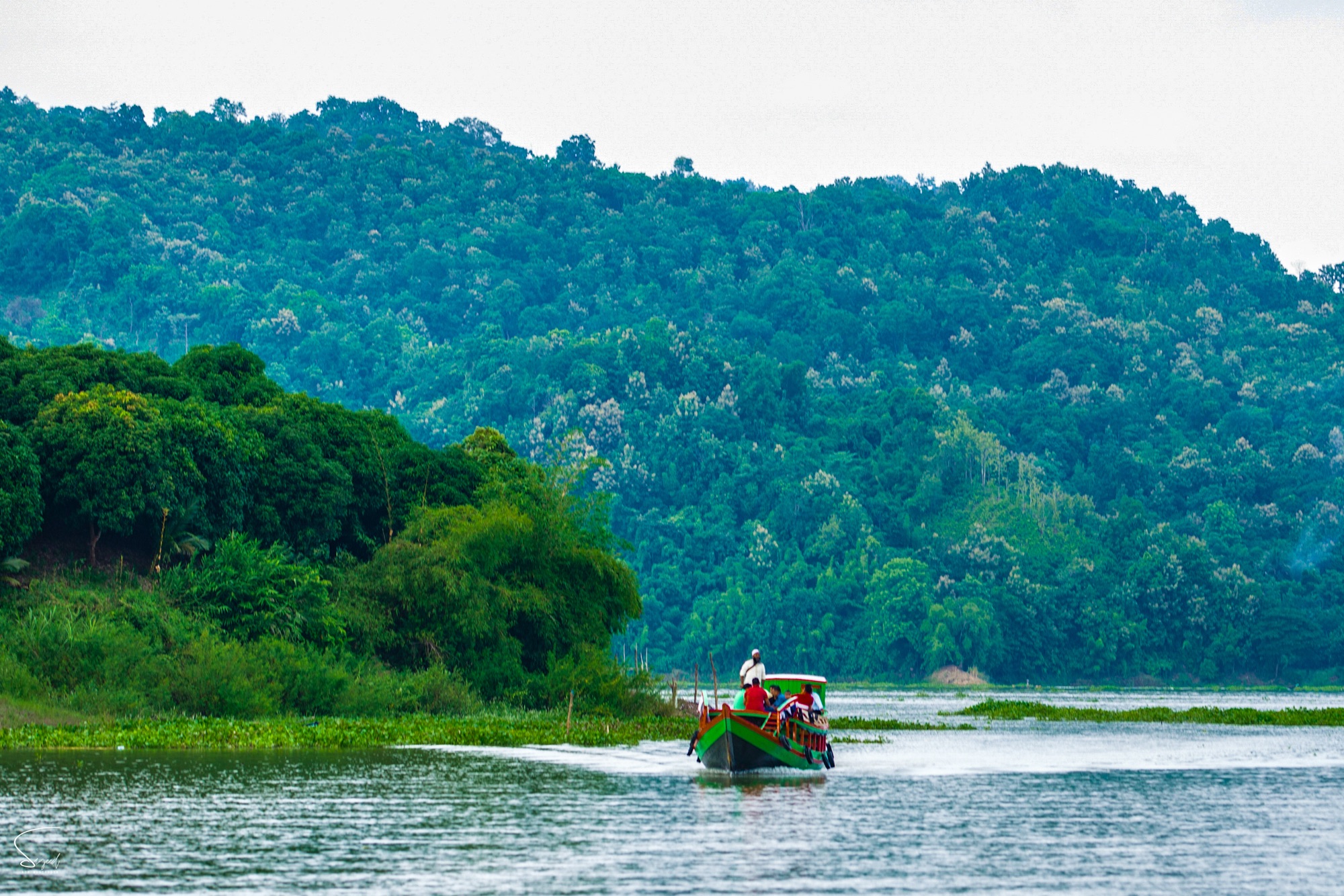 A tourist boat sailing at dusk, Rangamati