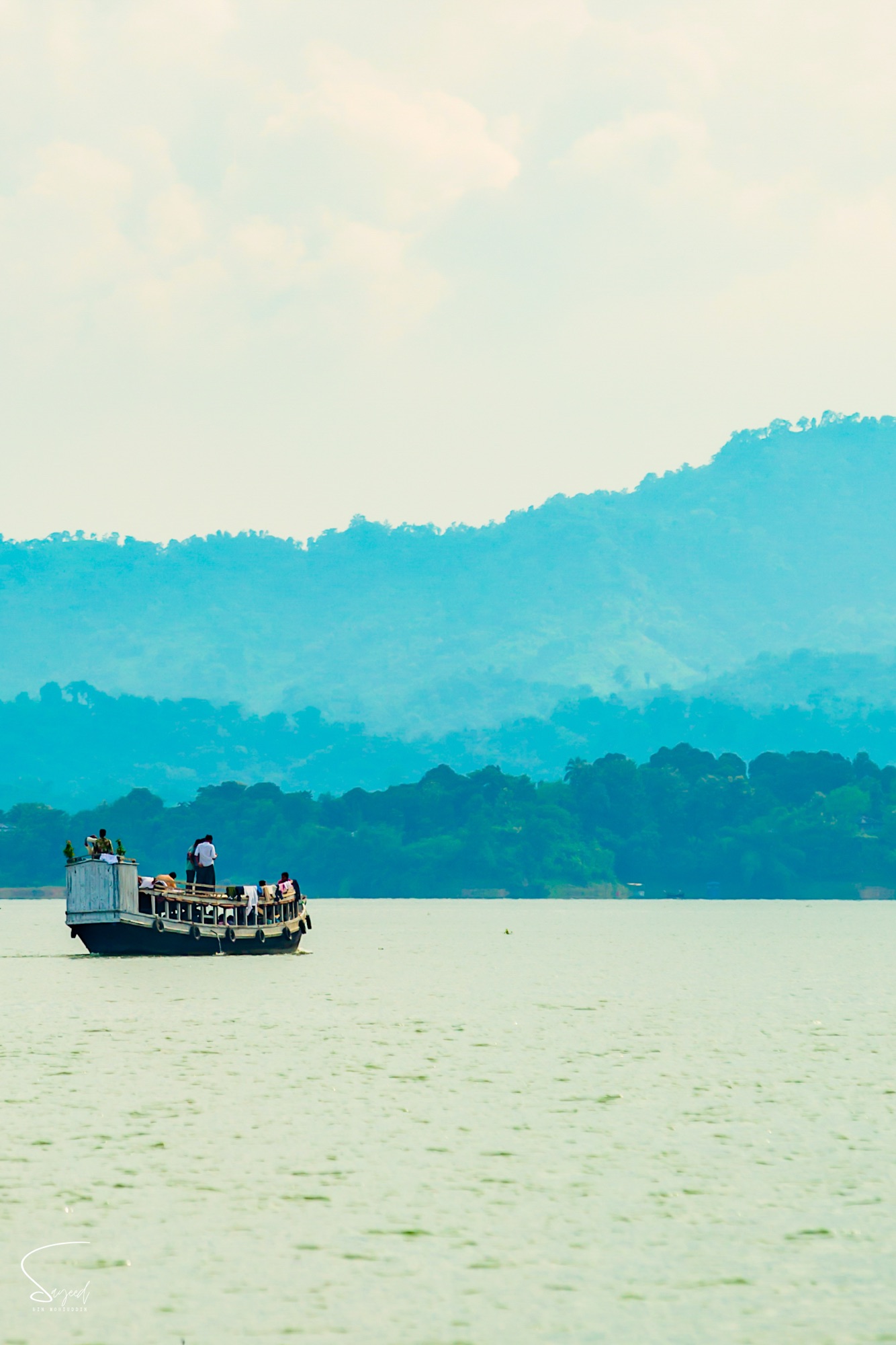 A passenger boat on the still lake, Rangamati